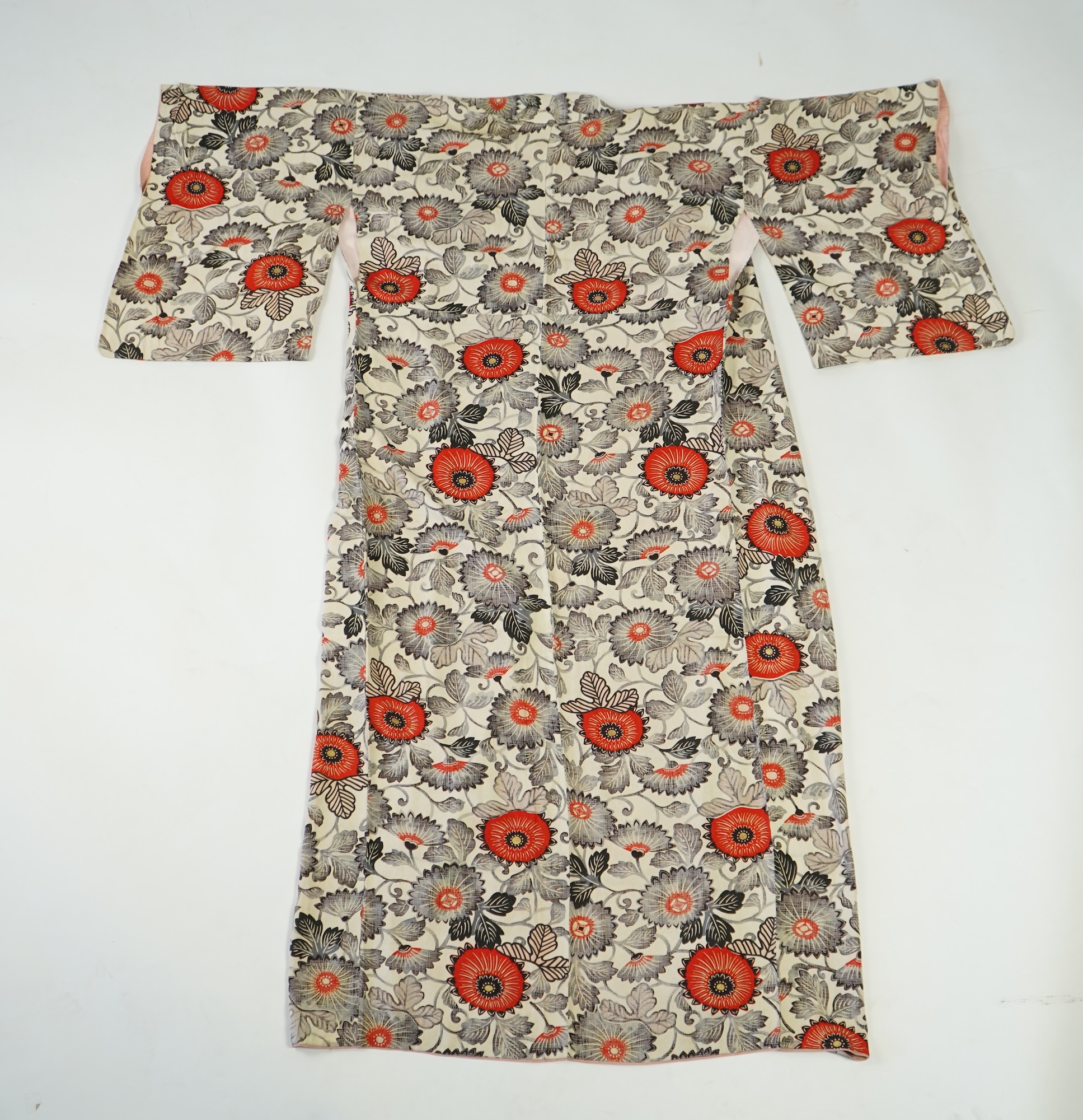 Four 1930’s - 1950’s printed silk full length silk lined Japanese kimonos. Two floral and two geometric in design. Longest black and orange floral designed kimono, 150cm long. Condition - purple and pink check kimono the